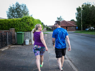 Sarah J Naylor walking with a client during a Walk & Talk Coaching session in Norfolk, combining coaching with movement and the benefits of being outdoors.