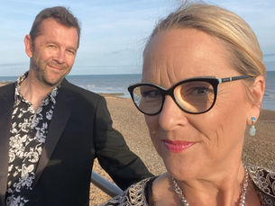 Sarah & Gareth dressed up on the beach