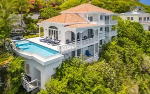 Luxury interior design in St. Thomas Virgin Islands featuring custom kitchens, elegant living spaces, and high-end finishes
