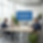 A business meeting in a modern office with a large screen displaying data on how skills-based hiring reduces employee turnover, showing a drop from 30% to 12%.