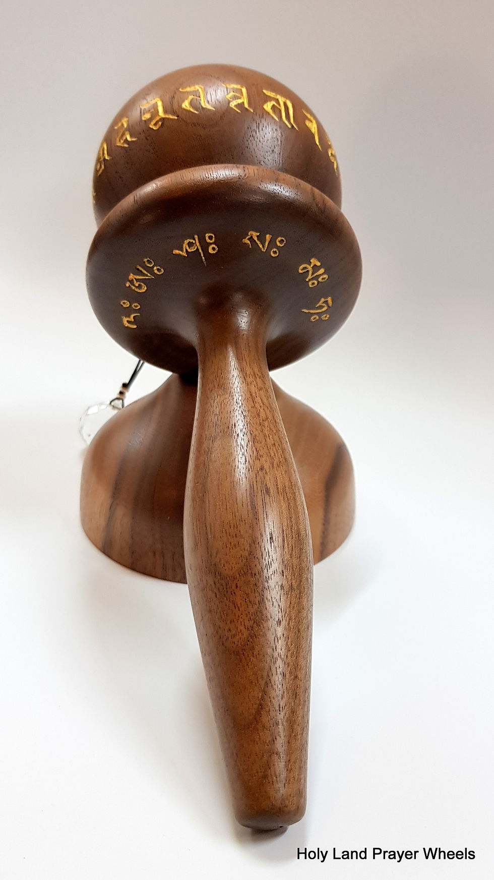 Thumbnail: A small size spherical design World Peace prayer wheel made from Walnut hardwood bottom view