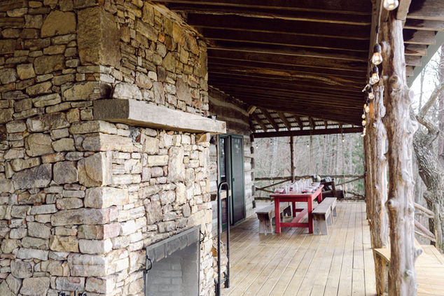 Back porch fire pit and red table 