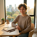 confident woman at desk looking at camera