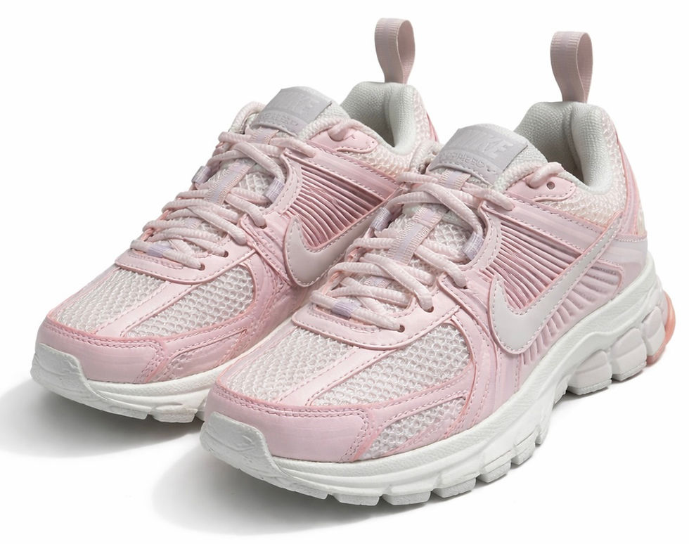 Pair of Nike Vomero baby pink trainers