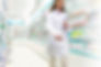Pharmacist in aisle of Pharmacy