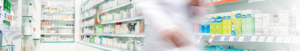 Pharmacist in aisle of Pharmacy