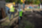 2 men operating a drill