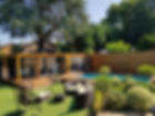 A garden room with outdoor sofas