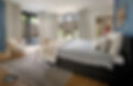 Image of a modern bedroom with drapes and blinds for each floor length window