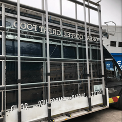A business van with a slab of glass.png