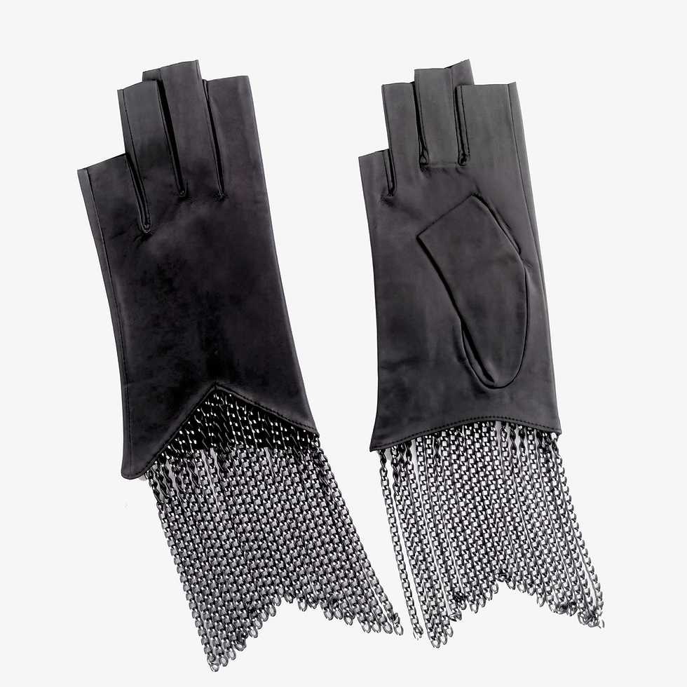 Flats of fingerless leather chain fringe gloves.