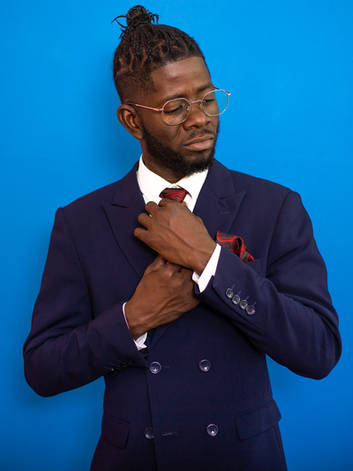 man wearing navy double breasted suit