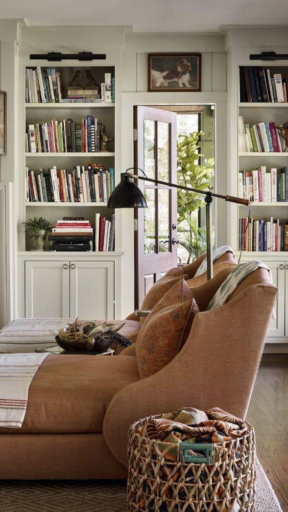 A cozy library with comfortable seating and lots of books.
