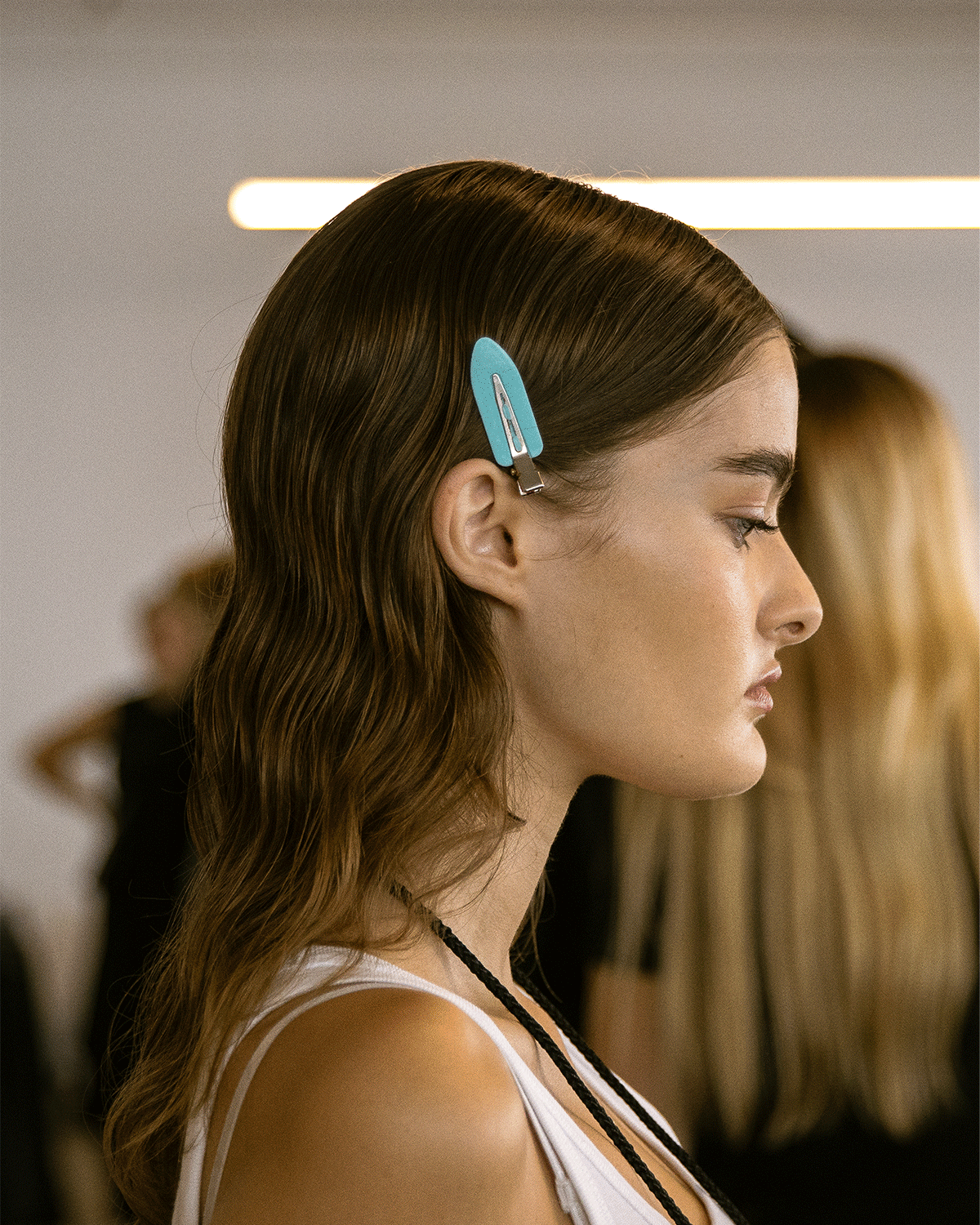 model with green hair clip