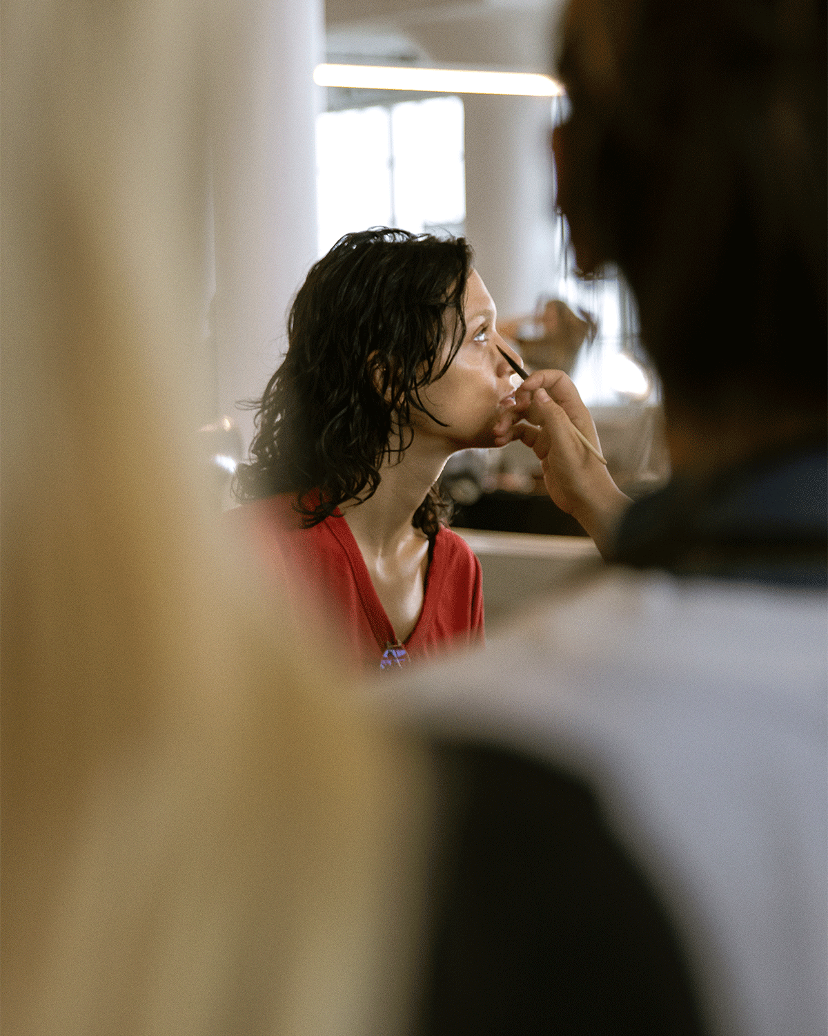 woman getting her makeup done