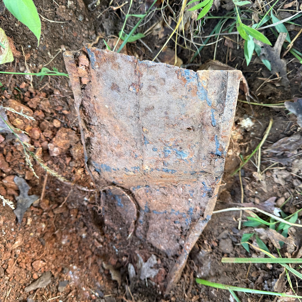 Part of the buried metal roof from the old two-room schoolhouse