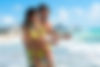 Young Couple Man and Woman Playing in Surf at Beach.jpg