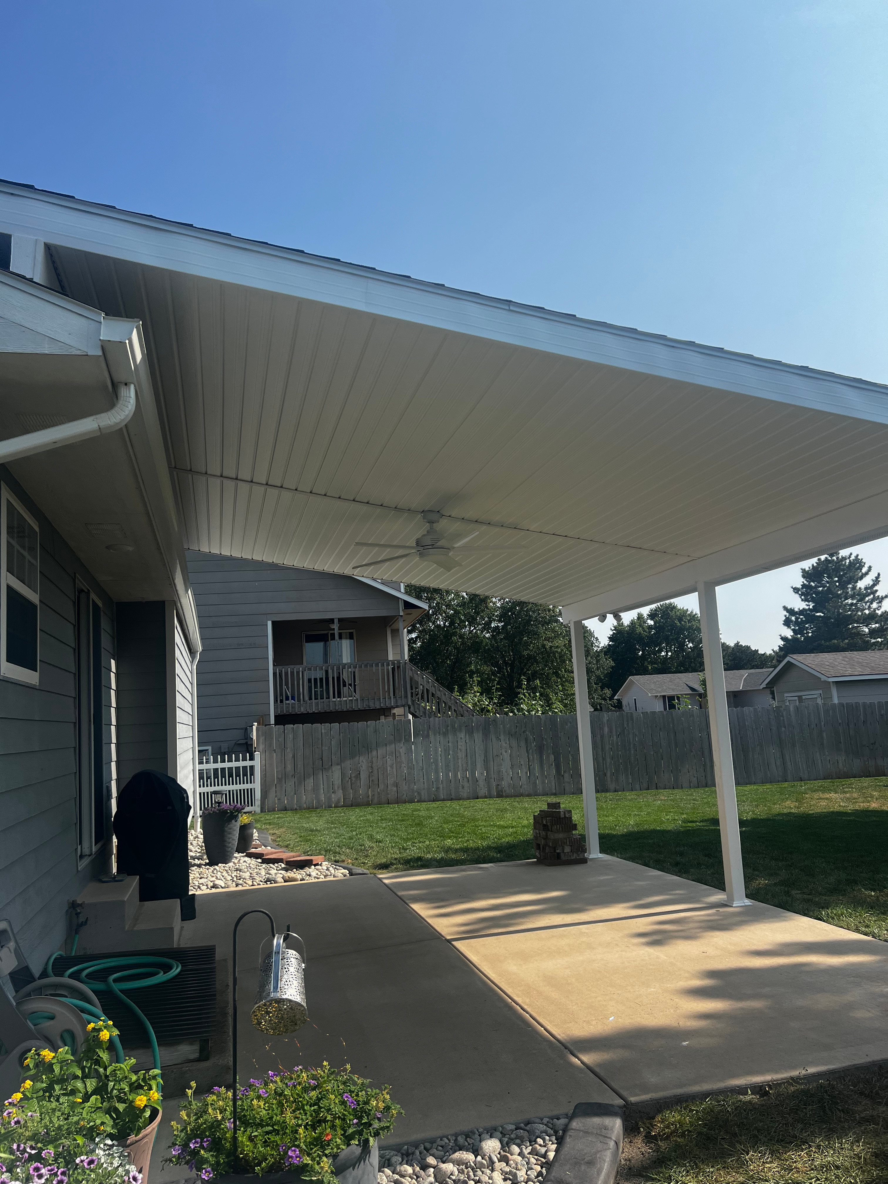 Pristine White Patio Cover with LOPRO Patio Roof Risers Patio Roof Riser