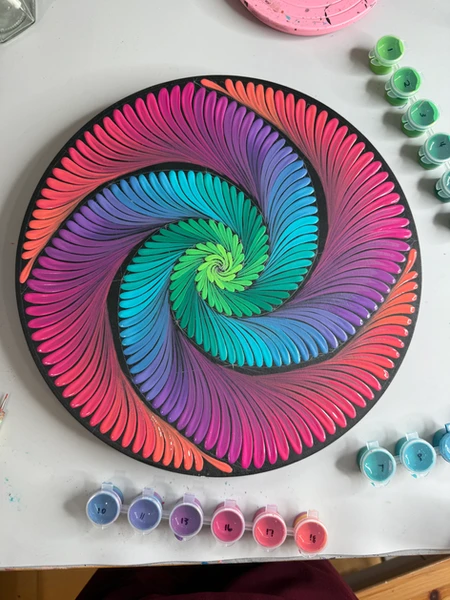 Spiral swoosh on 12 inch wood board with vibrant color gradient.