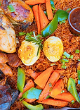 Best jollofrice served with boiled eggs, vegetables, roasted chicken, beef, shito.