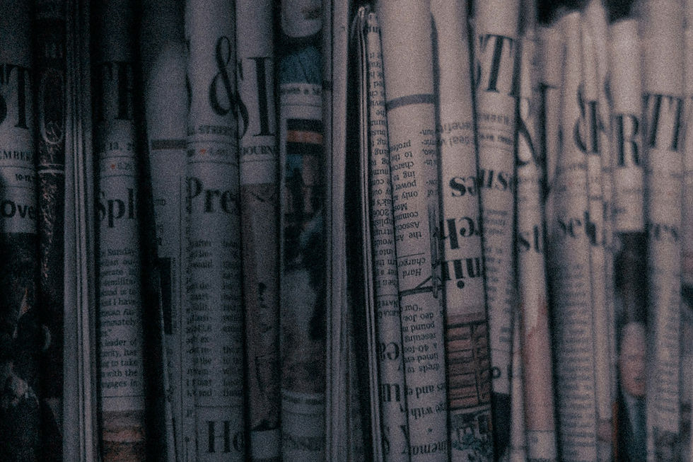 blurry photo of newspapers