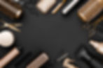 Hairdresser tools on black background with copy space in center.jpg