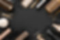 Hairdresser tools on black background with copy space in center.jpg