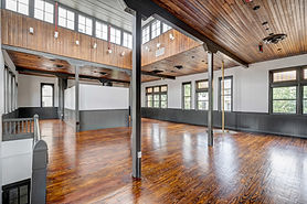 event space with wood flooring and high ceiling