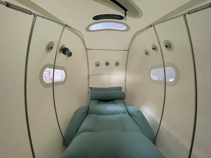Interior view of lie down seat inside hyperbaric oxygen chamber