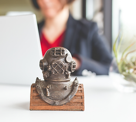 U.S. Navy diver bust, with Samantha Mathis, military career transition coach, in the background