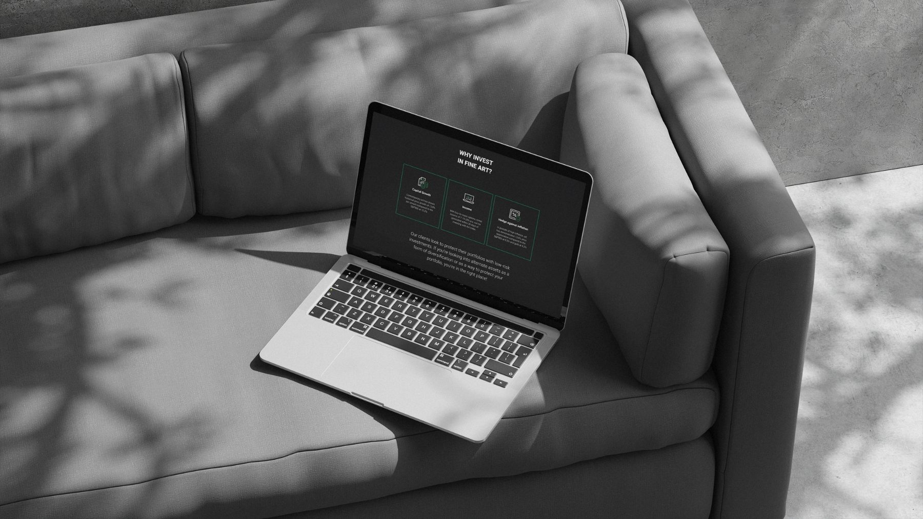 Art Index website on a laptop resting on a sofa