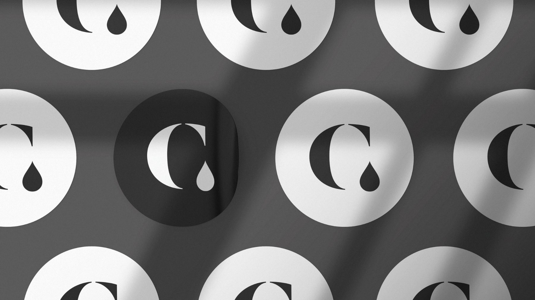 The Curious Co logo symbol pattern in black and white