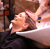CLIENT GETTING THEIR HAIR WASHED