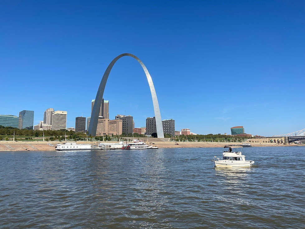 Boat cruising by St. Louis Arch on the Great Loop
