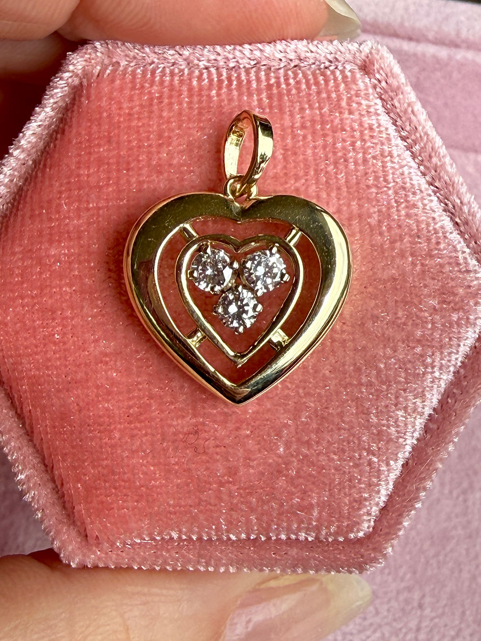 Vintage 14k gold double heart pendant featuring three illusion-set natural diamonds at the center, restored and polished for