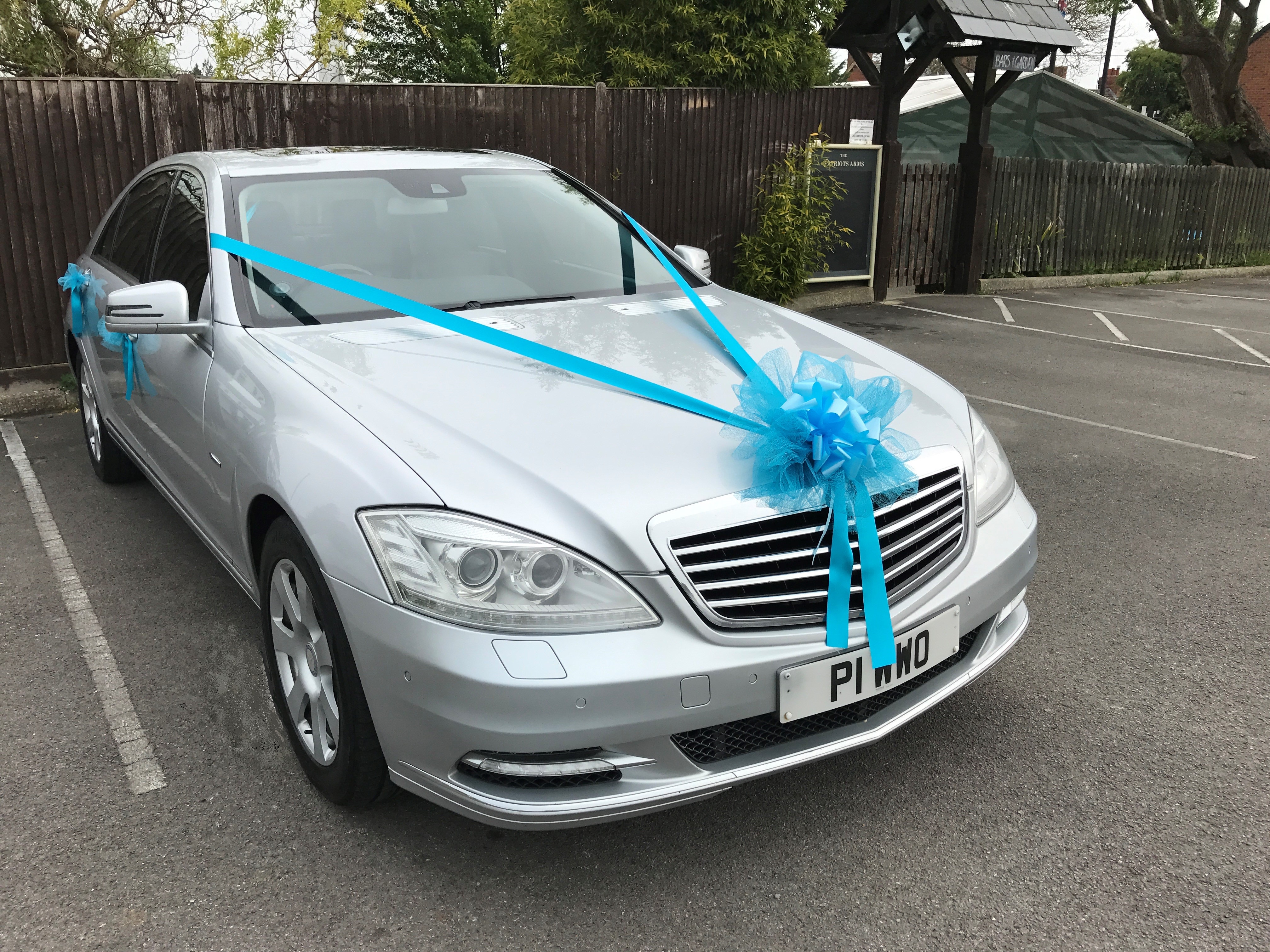 Wedding car with Peacock Blue ribbon