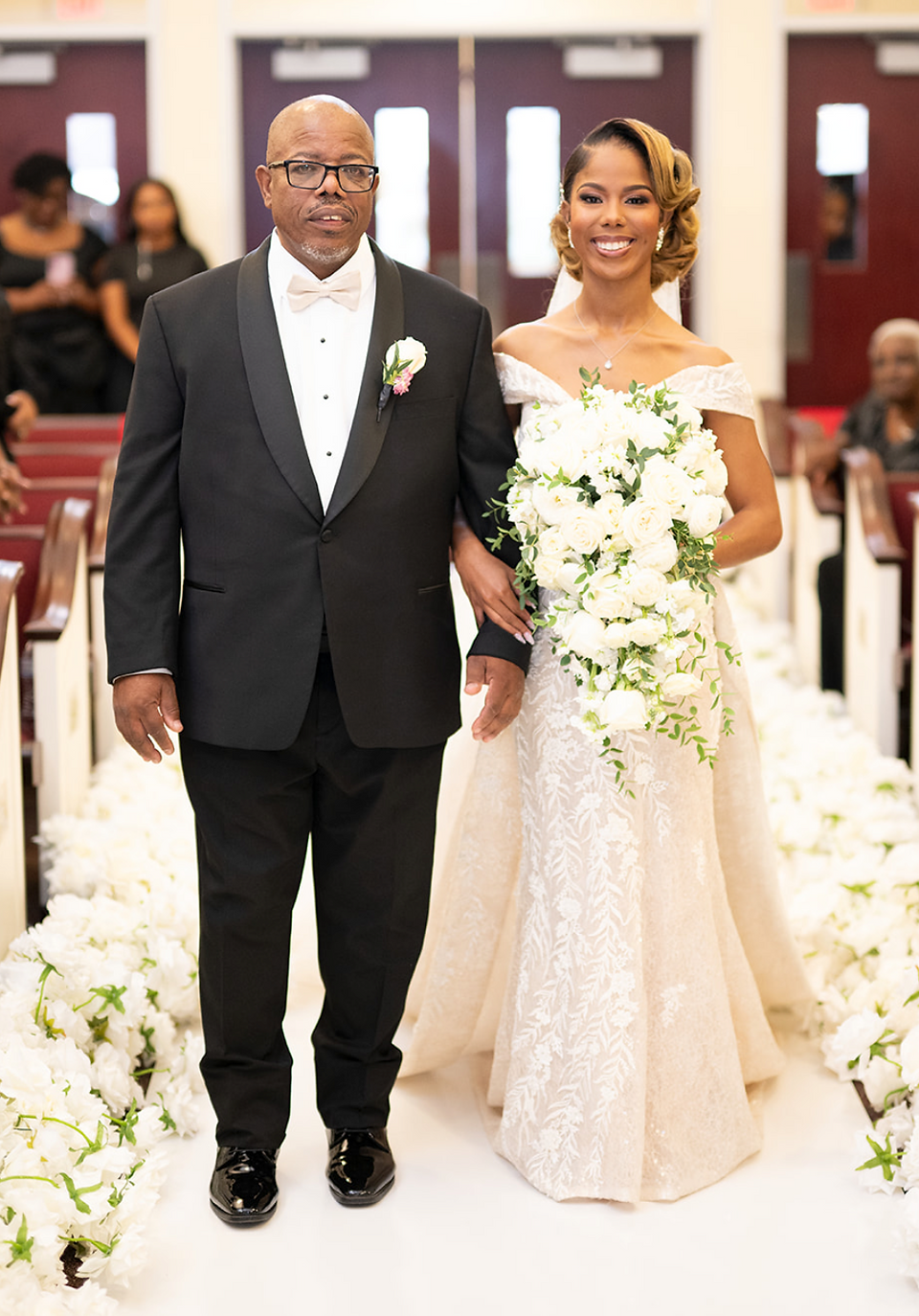 a bride with her dad walking down the aisle