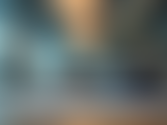 Telephone on a desk with a laptop computer