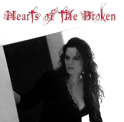 Black-and-white portrait of a person with long curly hair in dramatic lighting near a doorway — stylized cover art for ‘Hearts of The Broken’ by Lady in White, evoking melancholy, strength, and emotional vulnerability.