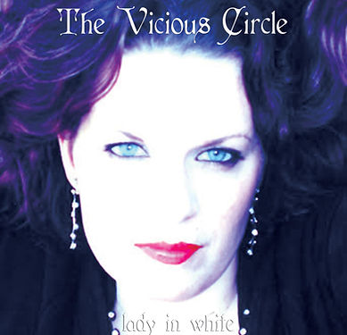 The cover of Lady in White music album The Vicious Circle shows a closeup of Tanya Madsen looking serious and intense with a filter to turn her hair purple and her face white with the title written in a dictinctive font
