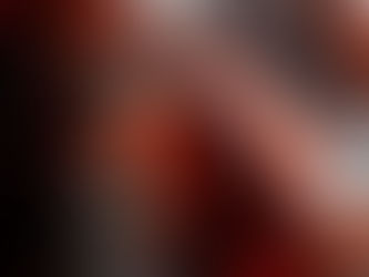 Abstract symmetrical artwork featuring bold red, black, and white brushstrokes mirrored along a vertical axis.