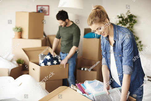 stock-photo-waist-up-of-moving-house-couple-546771652.jpg