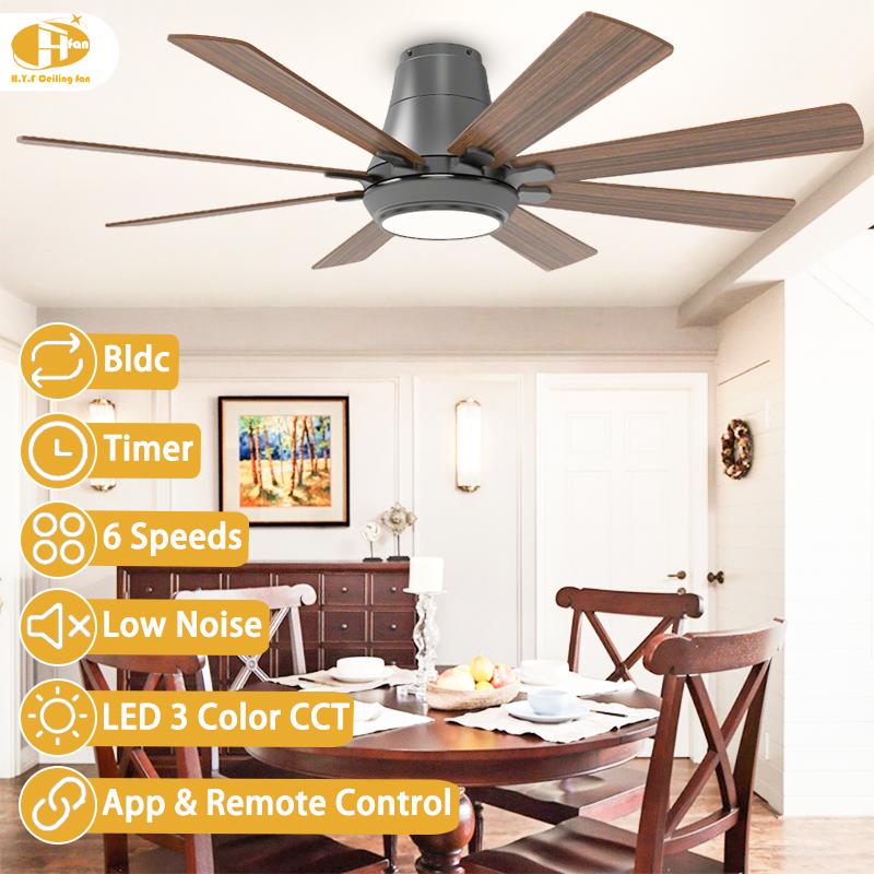 Low profile ceiling fan with light for dining area, eight wood-grain plywood blades and black housing above a table.