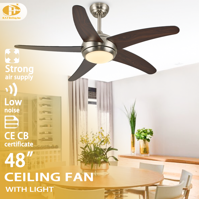 Brushed nickel ceiling fan with light for dining area, five dark wood-grain ABS blades shown above a table.