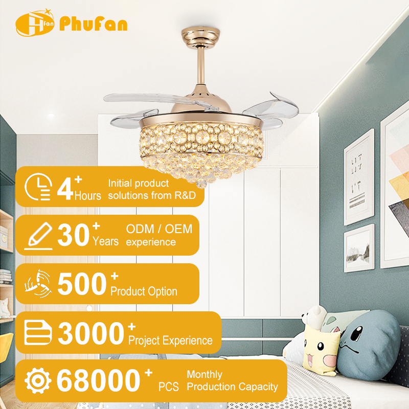 Chandelier ceiling fan with light for bedroom, gold crystal shade and clear retractable blades pictured above a bed.