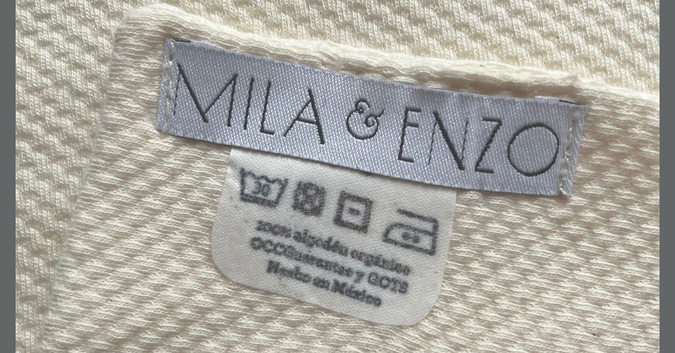 Etiqueta de un Mini Repetidor con las instrucciones de lavado y certificaciones de la tela.