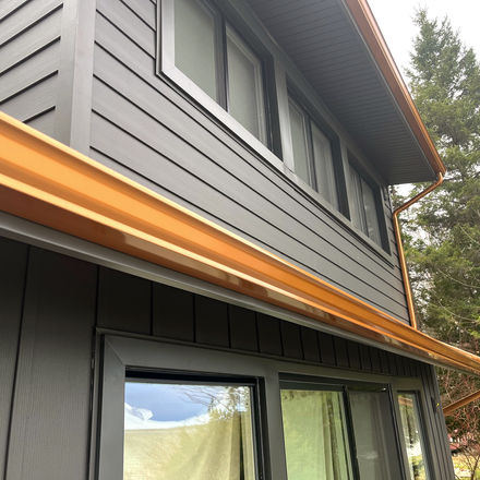 Copper colored gutters installed by Midwest Exteriors