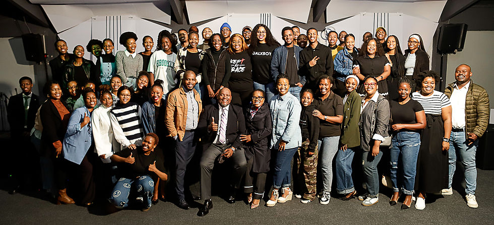 Large group of smiling people showing who we are.