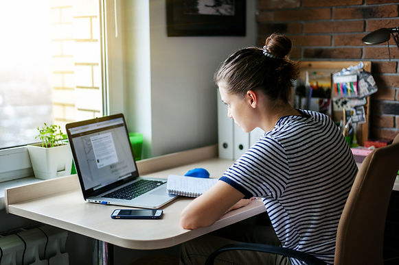 Teenage girl completing her UCAS personal statement in her bedroom: The Parents' Guide to