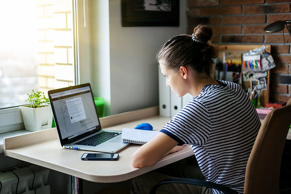 Teenage girl completing her UCAS personal statement in her bedroom: The Parents' Guide to
